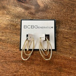 Gold hooped earrings never been worn BCBG